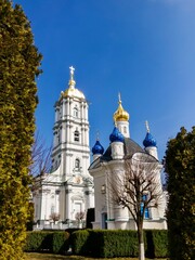 Churches in Pochaev against the background of the blue sky, Ukraine