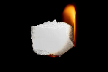 burning paper, glowing edge of paper on a black background