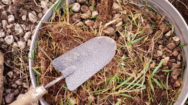 Garden landscaping with soil sieve and spade