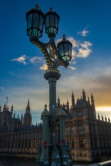Fototapeta na wymiar House of Parliament with street lamp in London, taken from Westminster Bridge at sunset