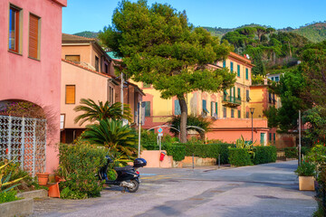 Scenic view of Monterosso al Mare, cozy seaside town in Cinque Terre National Park, beautiful cityscape with colorful houses, green trees and hills, Liguria region of Italy. Outdoor travel background