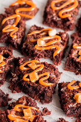 Chocolate brownies with caramel on kitchen paper