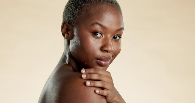 Skincare, beauty and black woman touch shoulder for self care, wellness and cosmetics on studio background. Dermatology, spa aesthetic and portrait of African girl with glow, facial and confidence