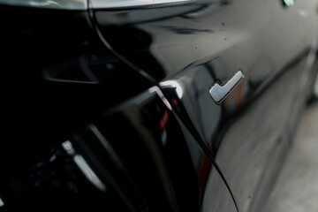 Door and door handle of a new luxury car in the interior