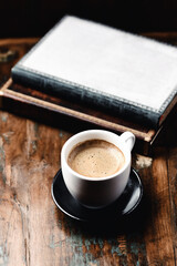 Cup of coffee on wooden background. Close up.	