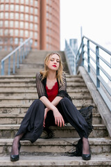 Executive blonde woman sitting off the office