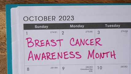 Breast Cancer Awareness Month written in pink on an October calendar.