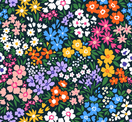 Cute floral pattern in small flowers. Small colorful flowers. Dark blue background. Ditsy print. Floral seamless background. Liberty template for fashion prints. Stock pattern.