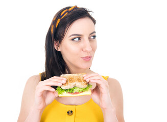 Close up young woman eating sandwich. Beautiful girl enjoying in fast food, delicious snack, isolated on white background