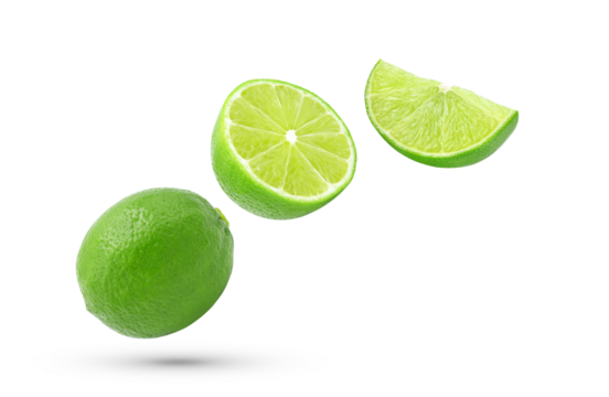 Whole, half and slice fresh lime fruit falling in the air isolated on white background.