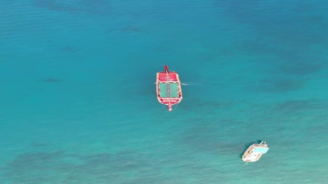 Drone flight near the rocks of Alanya, Turkey, with a view of the mountains, the old fortress and pirate ships