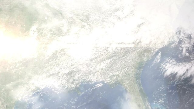 Earth zoom in from outer space to city. Zooming on Hueytown, Alabama, USA. The animation continues by zoom out through clouds and atmosphere into space. Images from NASA