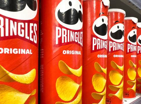 Yerevan, Armenia, March 21, 2023: Pringles chips pack with a new logo in a raw. Pringles logo