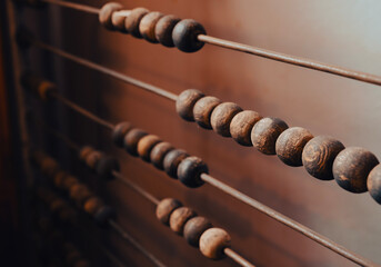 Vintage old accounting wooden abacus. Close up.