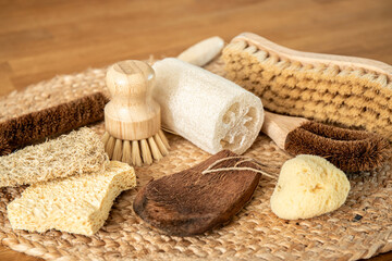 Collection of various cleaning brushes and sponges of various natural materials in home kitchen....