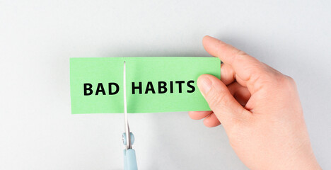 Bad habits sign cut with scissors, break a habit, stop smoking, quit drinking alcohol and unhealthy...