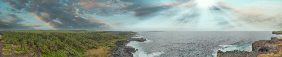 Amazing panoramic aerial view of Mauritius Island at sunset along Pont Naturel arch formation
