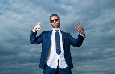carefree business man point finger in suit. photo of carefree business man in suit.