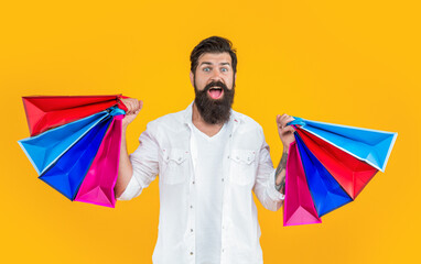 bearded shopaholic man in studio. shopaholic man on background. photo of shopaholic man