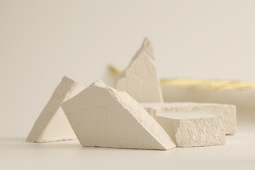 Empty stack of stones platform podium beige background. Minimal empty display product presentation scene.