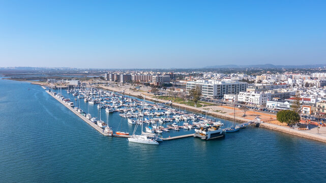Aerial view of Portuguese fishing tourist town of Olhao overlooking the Ria Formosa Marine Park. sea port for yachts