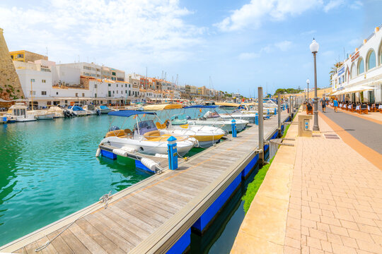 Boats line the picturesque marina port harbor at Ciutadella de Menorca, on the Balearic island of Menorca in the Mediterranean Sea.