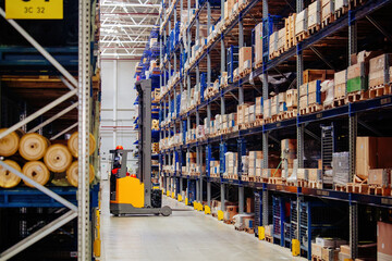 Modern warehouse interior with shelves and boxes and forklift loader - obrazy, fototapety, plakaty