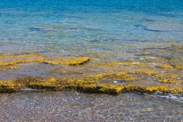 Beautiful view clear water of Mediterranean sea stone coastline. Greece.