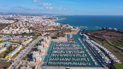 Aerial view portuguese fishing tourist town Albufuira with creative architecture. Portugal Algarve. front view