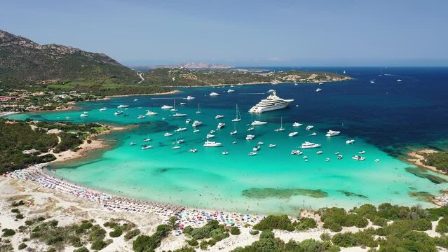 Stunning beaches and islands of sardinia with luxury yachts and boats over crystal water