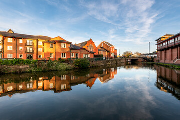 Fototapeta na wymiar Reflection of Chester Residents in River Dee UK