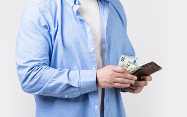 cropped view of man pay money in studio. man pay money banknotes.