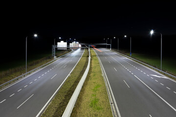 Fototapeta na wymiar modern empty highway at night with LED street light