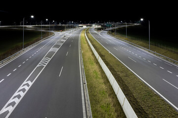 Fototapeta na wymiar highway crossroad at night with modern street lights