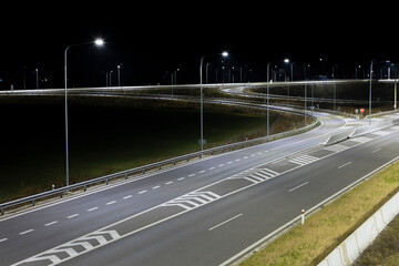 highway at night with modern LED lamps - 583658969
