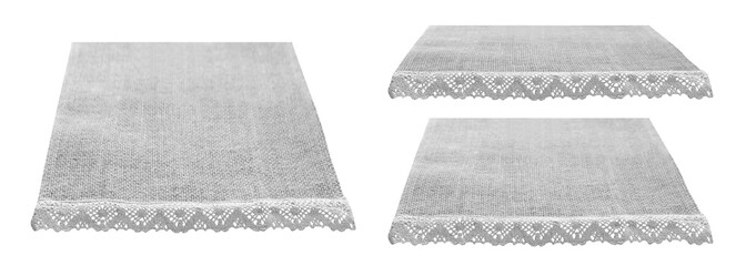 Thre canvas napkins with lace, natural burlap runner perspective isolated on white set. Can used for display or montage product. Selective fokus