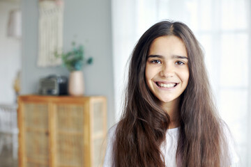 12s girl pose in cozy living room
