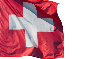 Country flag. Swiss flag. Switzerland flag against blue sky. One red square flag with a white cross in the centre. 