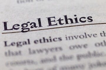 legal or law book with legal ethics focused in closeup of explanation
