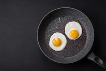 Delicious nutritious English breakfast with fried eggs and tomatoes