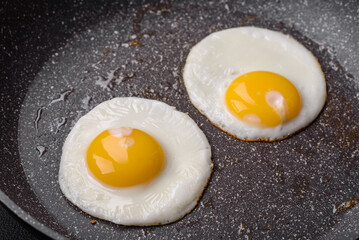 Delicious nutritious English breakfast with fried eggs and tomatoes