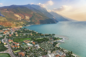 Garda lake and surroundings at sunset. View from the mountain in Riva del Garda, Italy.