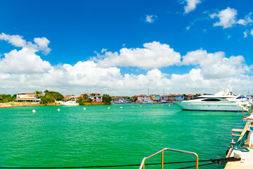 summer yacht in harbour with turquoise water. photo of summer harbour with yacht docked.
