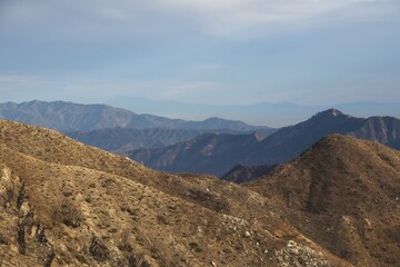 The winding Angeles Crest Highway provides views over the Los Angeles Basin and surrounding urban valleys, the snow-dusted San Gabriel and San Bernandino Mountains and the Mojave Desert