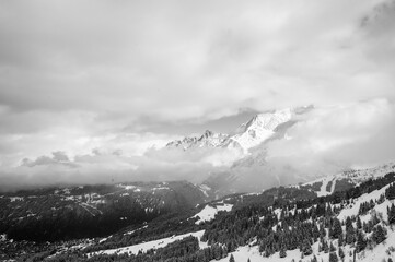 Cloudy snowy mountain in black and white