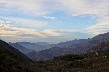 The winding Angeles Crest Highway provides views over the Los Angeles Basin and surrounding urban valleys, the snow-dusted San Gabriel and San Bernandino Mountains and the Mojave Desert