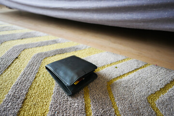  left wallet on floor at home 