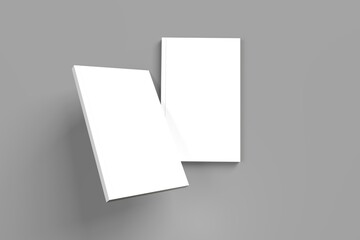 2 softcover book mockups are standing on a gray background, designed with 3D render visual effects that are indistinguishable from reality. A mockup, with flashy white covers resembling a real book.
