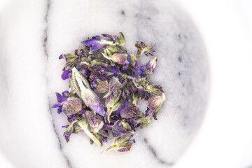 Close up of Lavender flowers and petals in a marble, mortor bowl