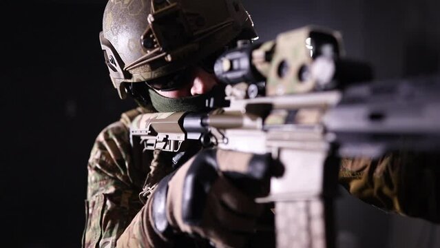 Military man aiming with a rifle. High quality FullHD footage